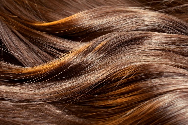 A Podiatrist covered up her DPM with her hair while giving Nutritional advice